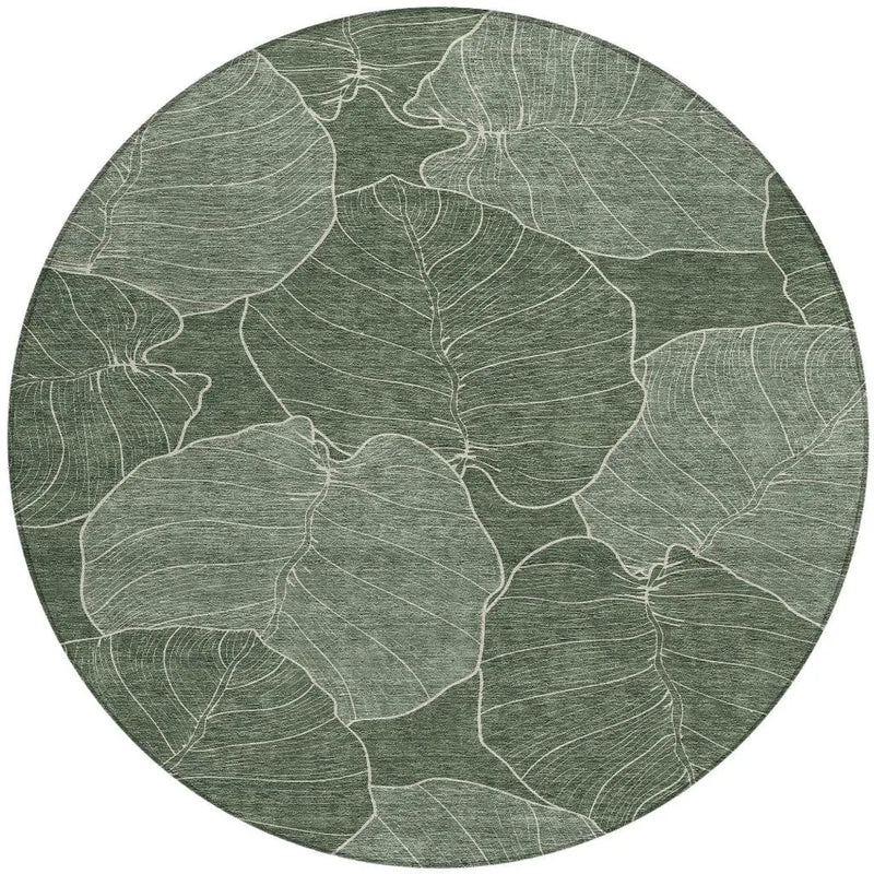 Round green leaf-patterned rug made of soft, durable material, perfect for modern or bohemian decor.