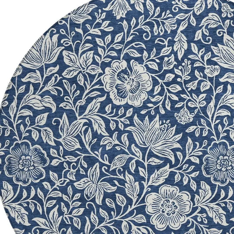 Navy blue floral patterned round rug made of durable, soft fabric, perfect for modern and traditional spaces.