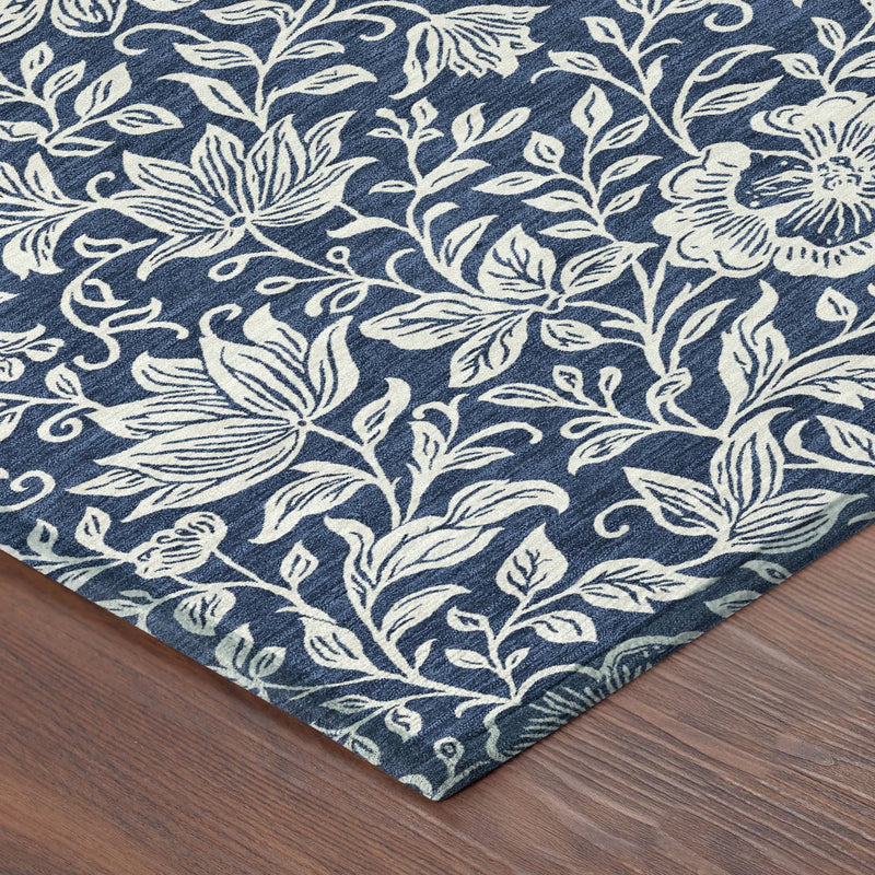 Navy blue floral area rug with ivory patterns, made of durable synthetic material, perfect for modern decor.