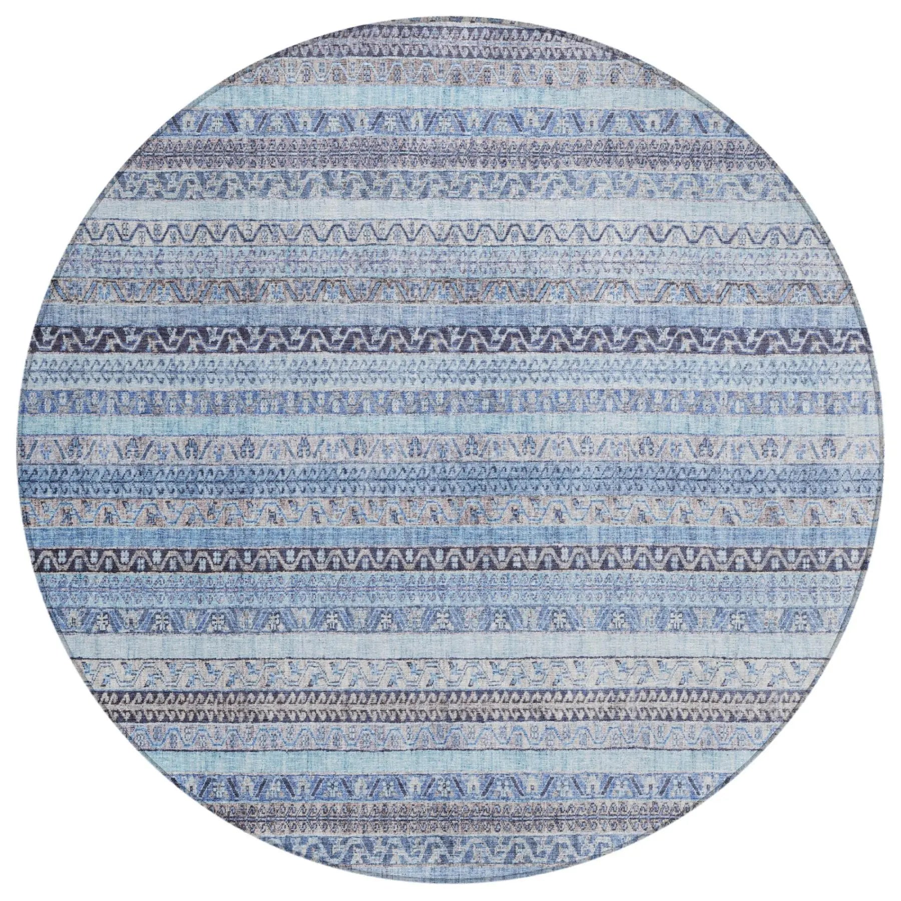 Round blue patterned area rug featuring intricate tribal designs in various shades of blue and subtle gray accents.