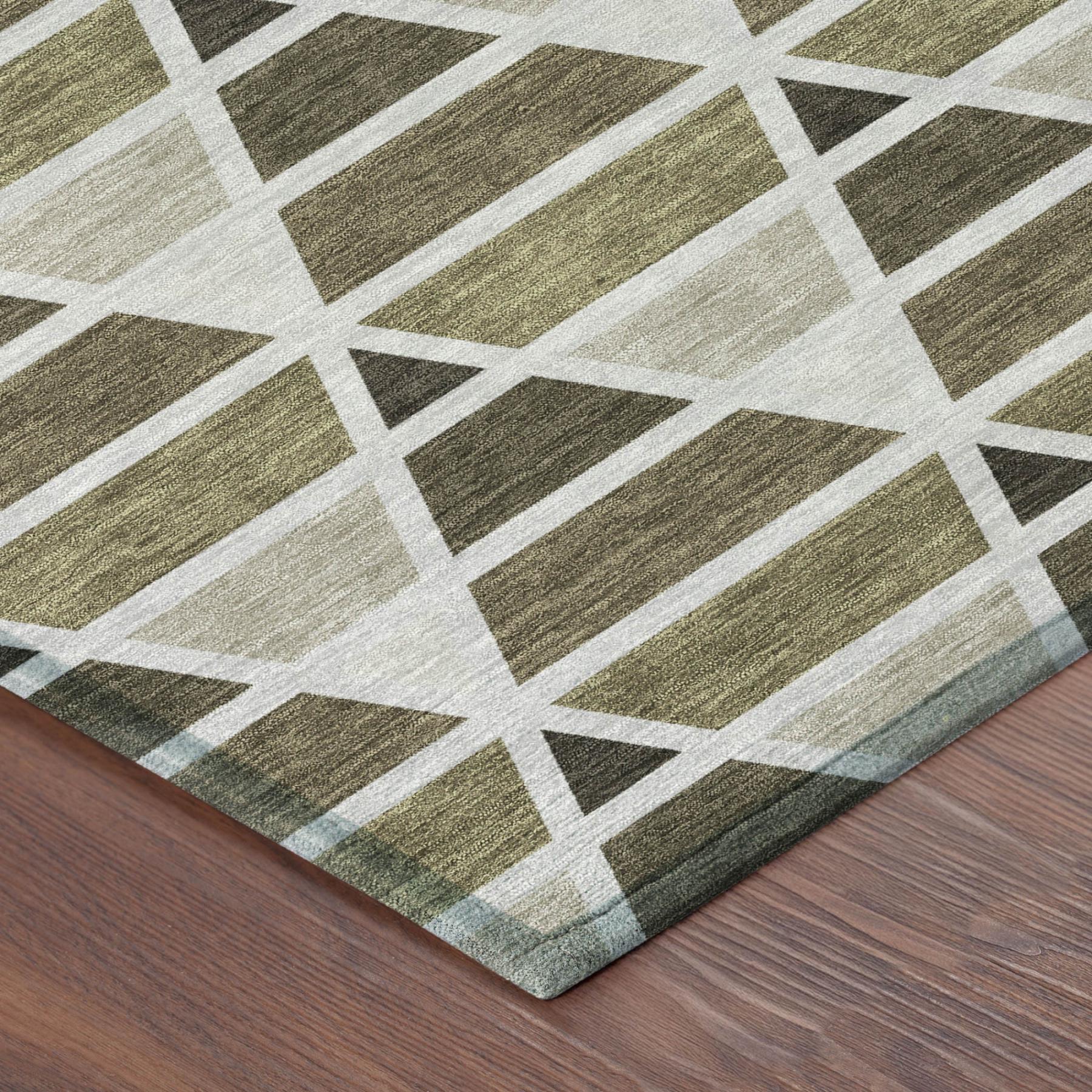 Modern geometric area rug in muted green and beige tones, crafted from soft polyester, perfect for contemporary decor.