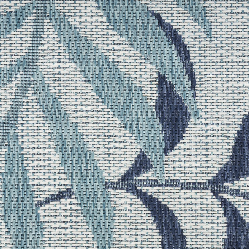Blue and navy patterned outdoor fabric, featuring a modern floral design, perfect for cushions and upholstery.