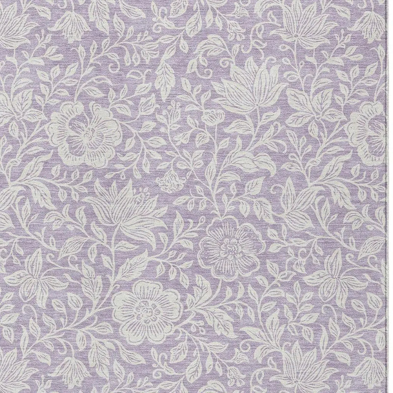 Lavender floral patterned fabric with white embroidery, perfect for home decor and upholstery projects.