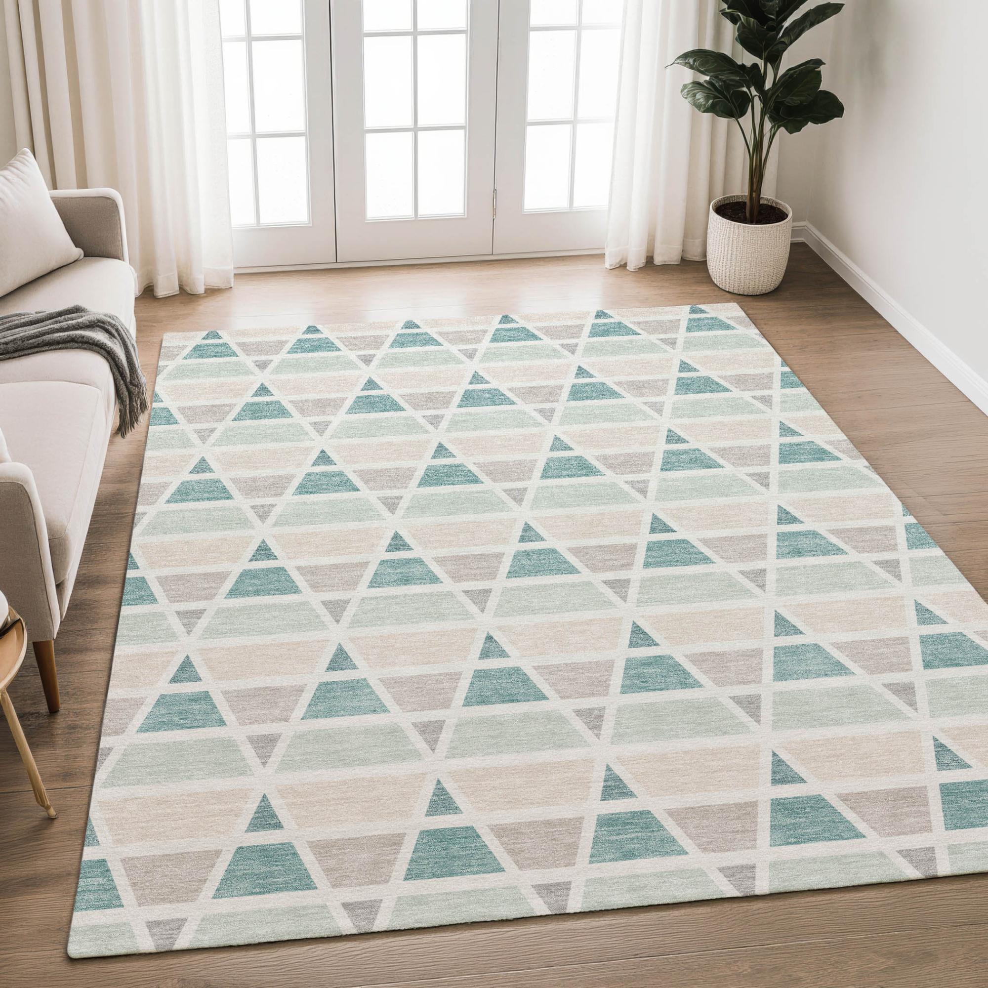 Geometric rug featuring teal, beige, and gray triangles, ideal for modern living rooms and stylish decor.
