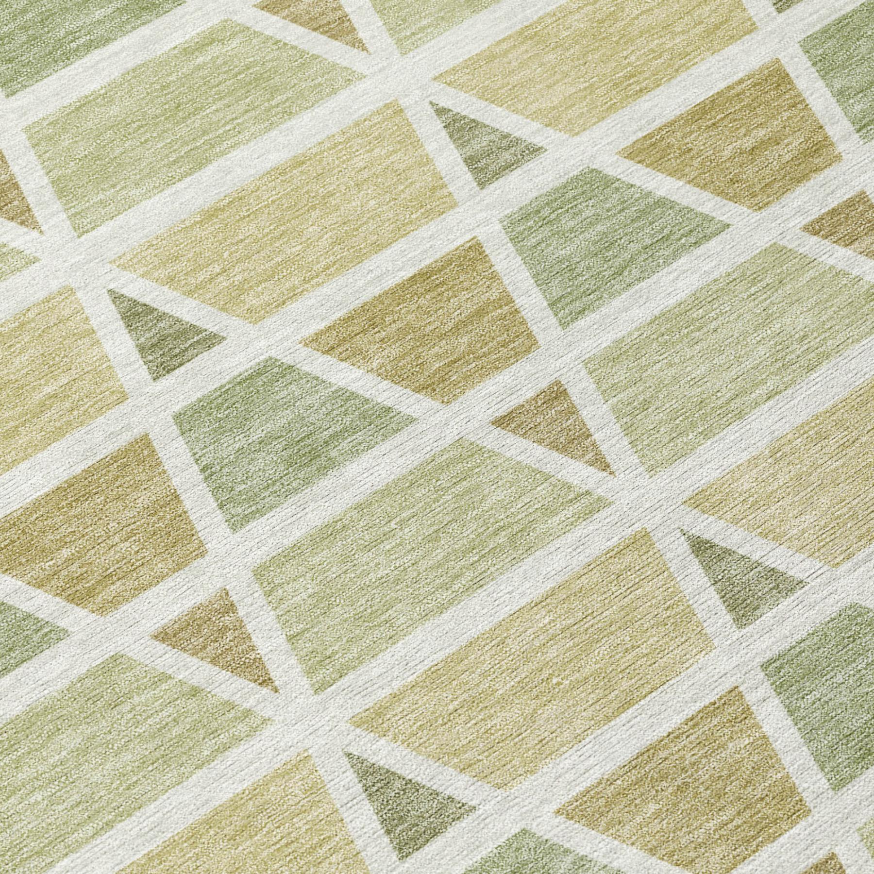Green and beige geometric patterned area rug, crafted from soft synthetic fibers for modern interiors.