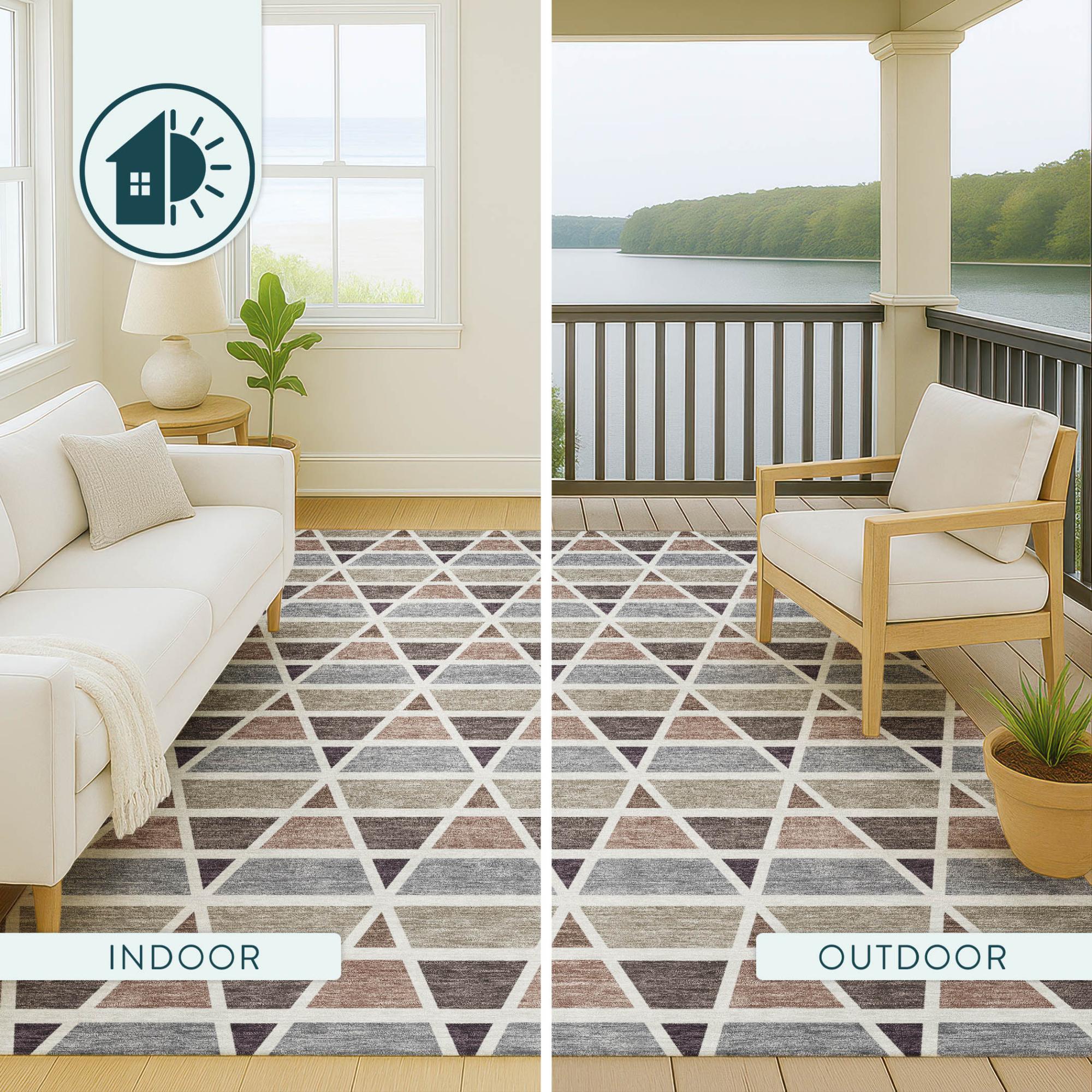 Geometric patterned area rug in gray, beige, and white; suitable for indoor or outdoor use, versatile and stylish.
