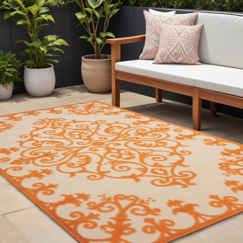 8' X 11' Orange And Ivory Damask Indoor Outdoor Area Rug - GreatEagleInc