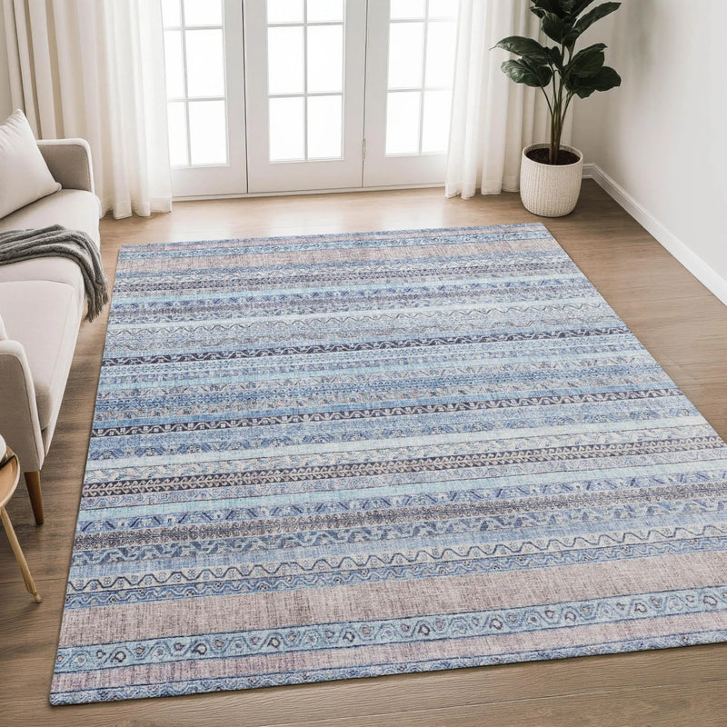 Blue and gray patterned area rug with stripes, featuring a soft texture, perfect for modern home decor.