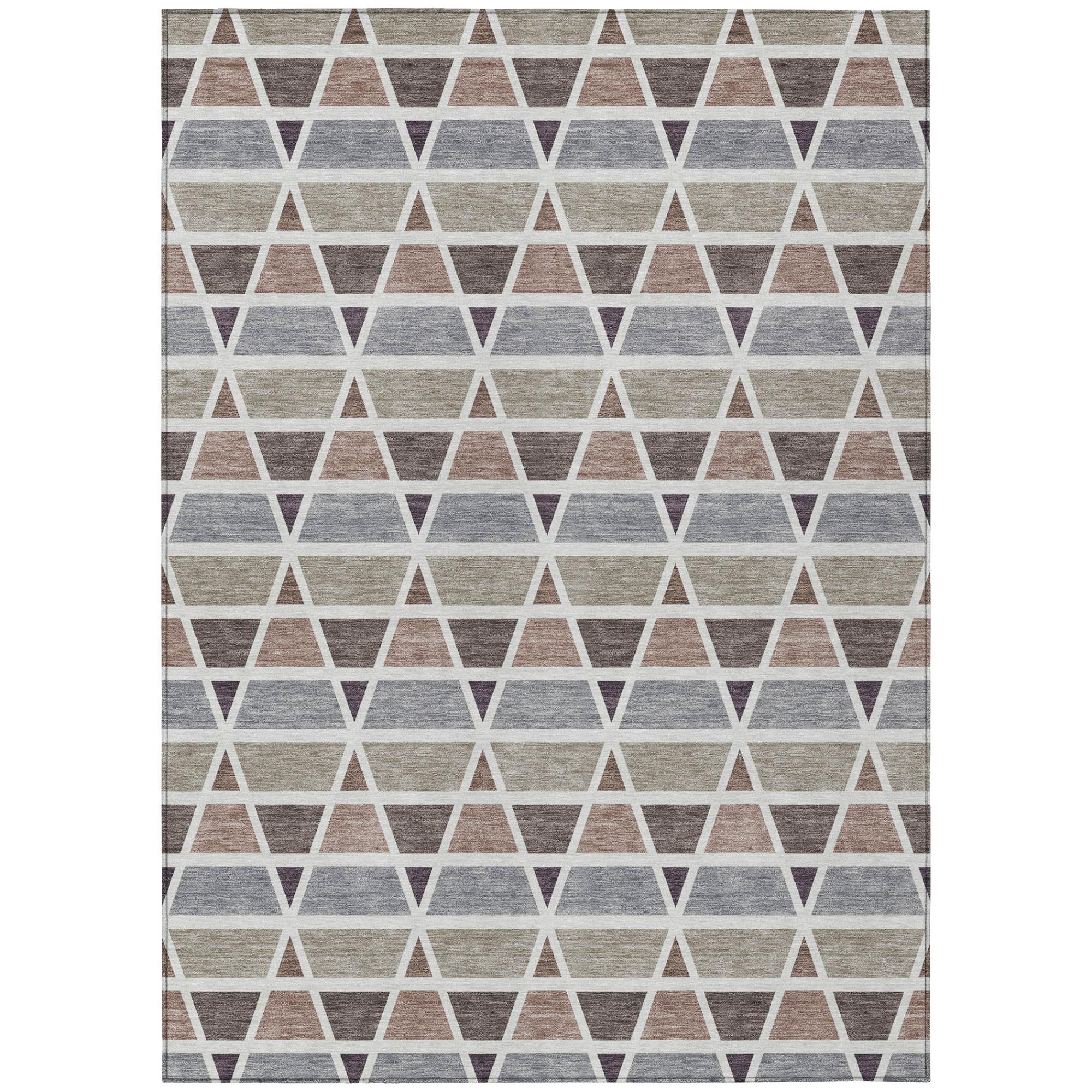 Geometric area rug with gray, beige, and purple triangles in woven fabric, perfect for modern decor.