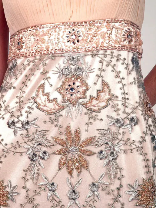A festive one-shoulder gold mini dress Raul E New York