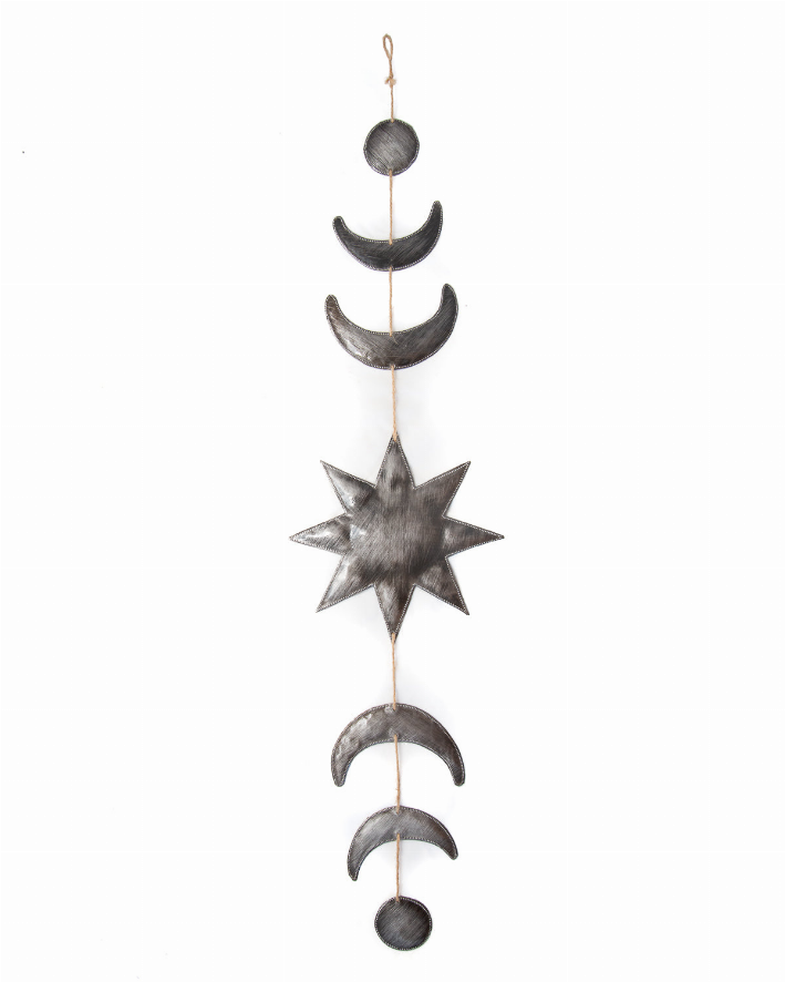 Metal moon and star wall hanging in black and silver, featuring celestial shapes for boho home decor.