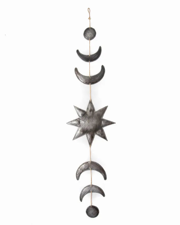Metal moon and star wall hanging in black and silver, featuring celestial shapes for boho home decor.