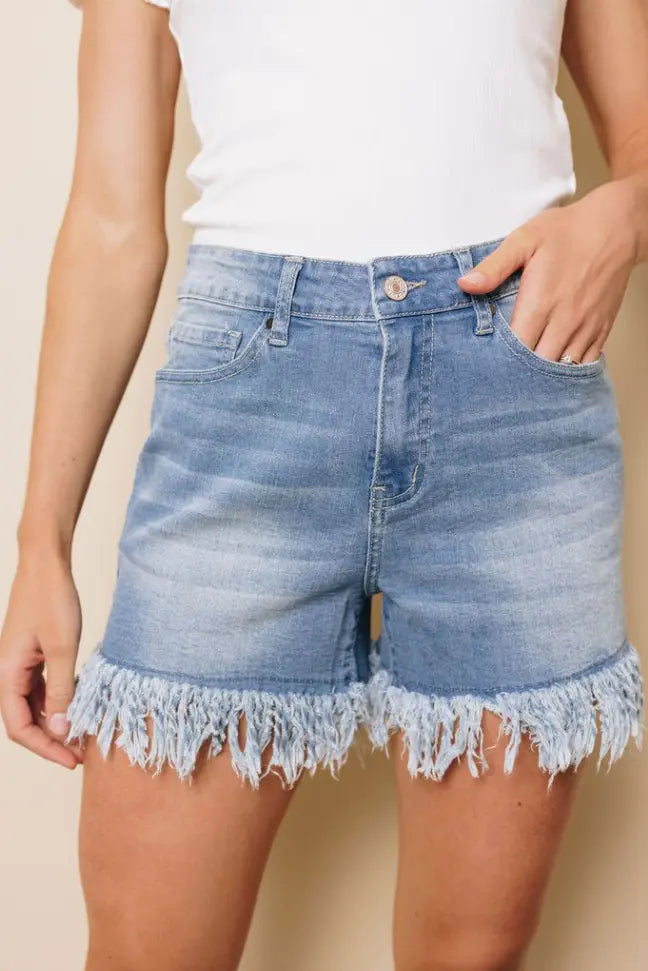 Fringe Hem Denim Shorts Stay Warm in Style