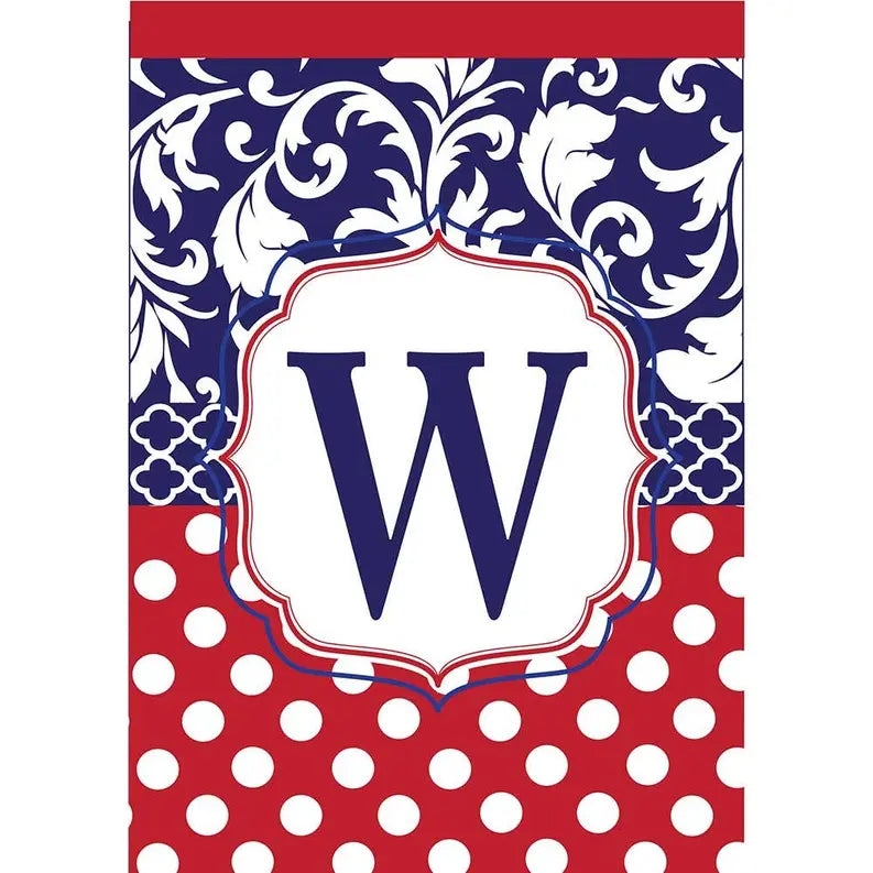 Navy and red decorative towel with floral pattern and polka dots, featuring a monogrammed 'W' in white.