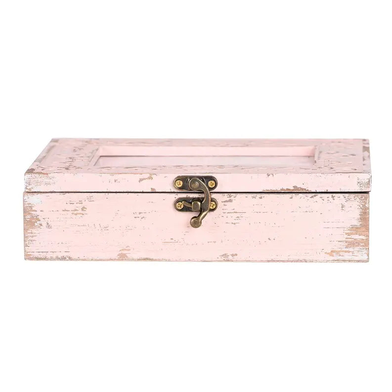 Vintage pink wooden storage box with a distressed finish and antique brass latch. Perfect for home decor and organization.