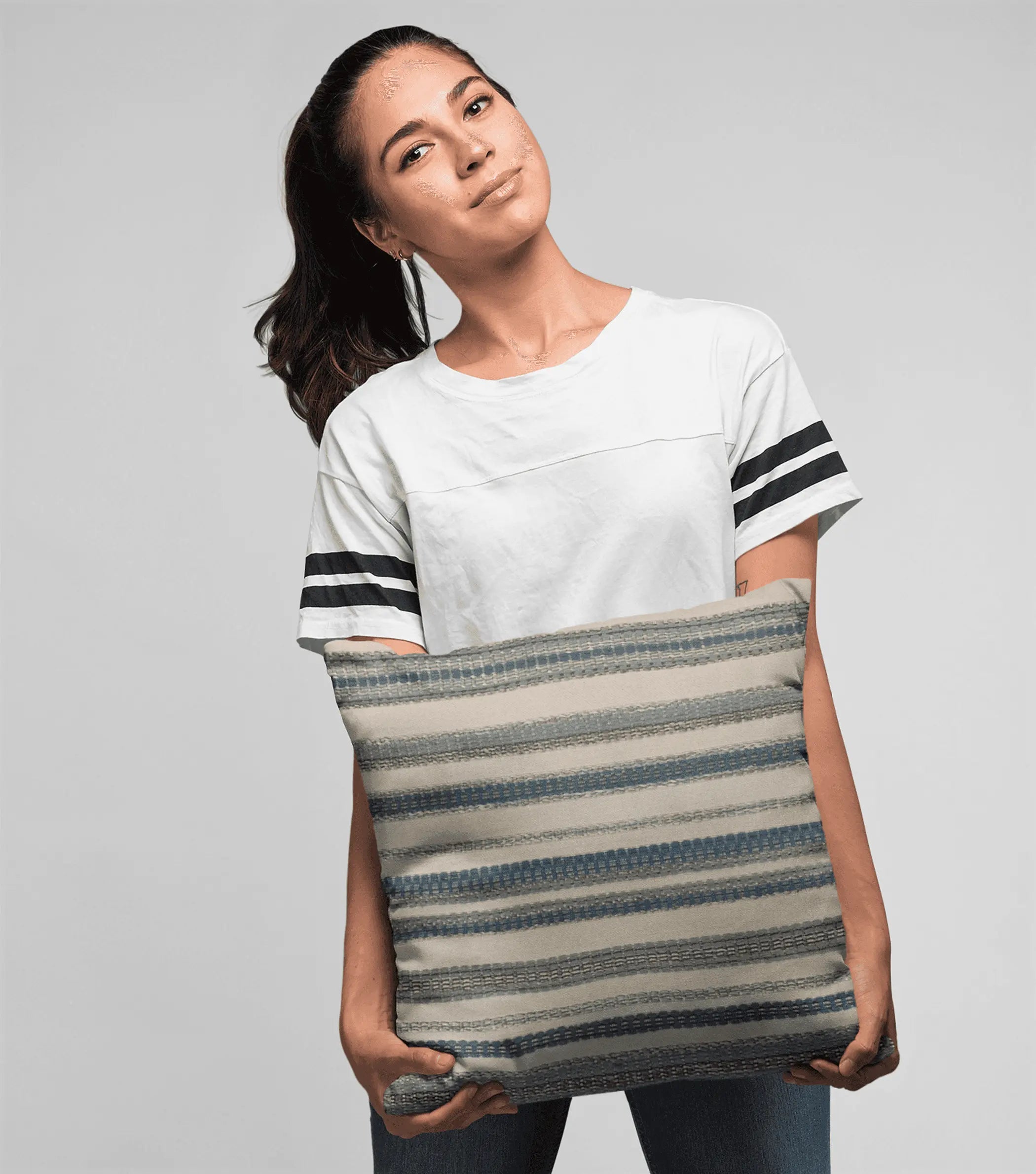 Striped decorative pillow in beige and blue, made of soft fabric, perfect for modern home decor.