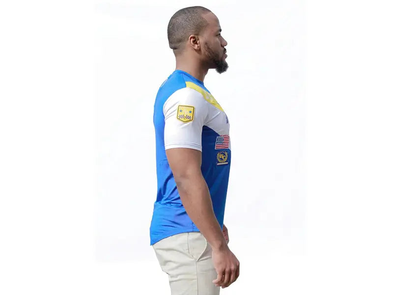 Men's blue and white athletic jersey with yellow accents and a USA flag patch, perfect for sports or casual wear.
