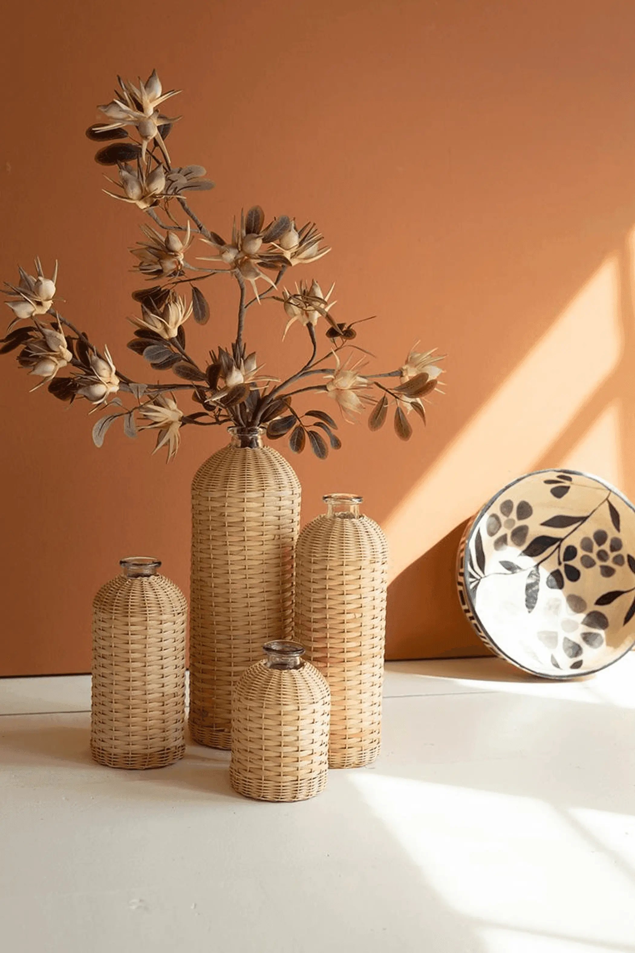 SET OF FOUR RATTAN WRAPPED GLASS VASES Kalalou