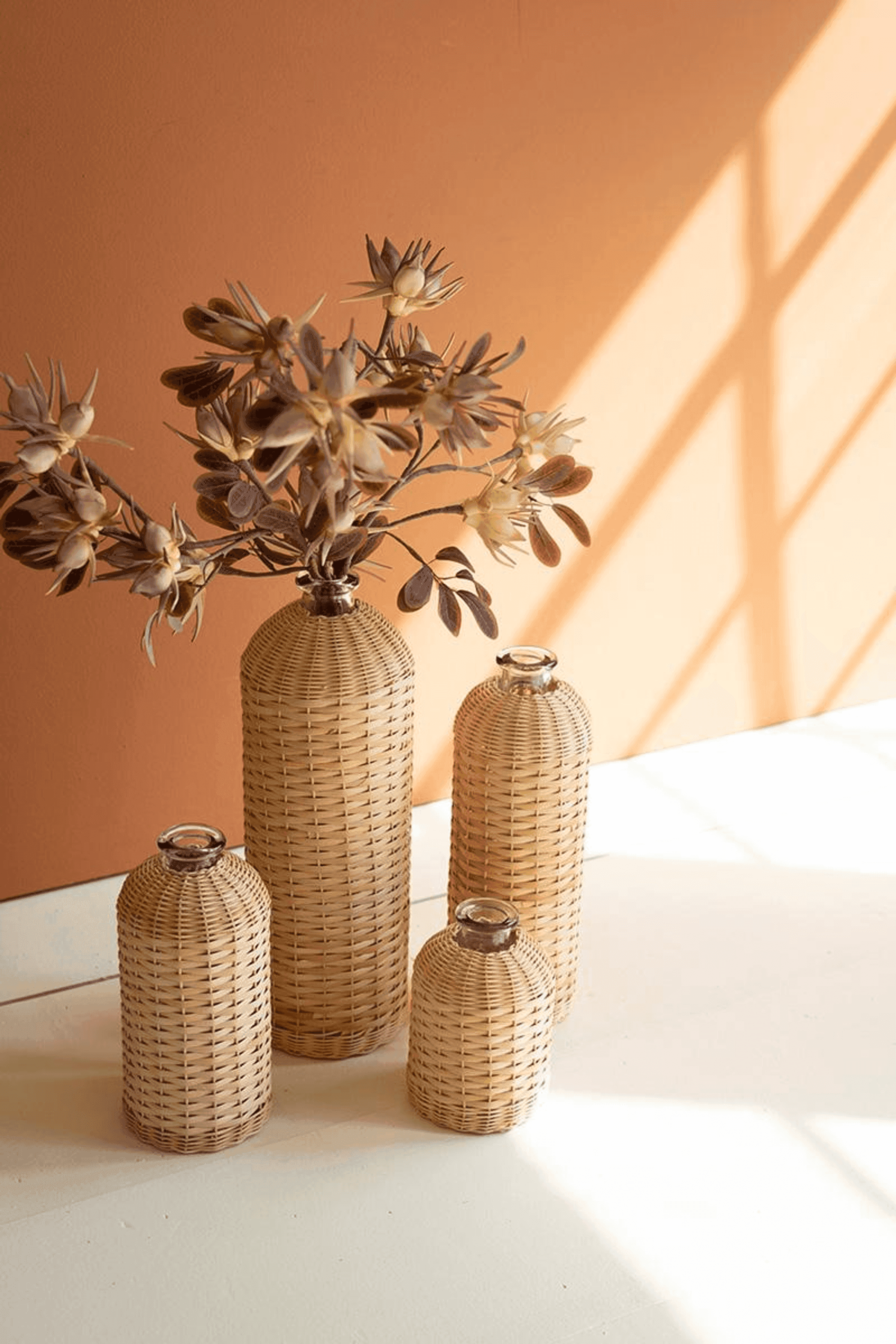 SET OF FOUR RATTAN WRAPPED GLASS VASES Kalalou
