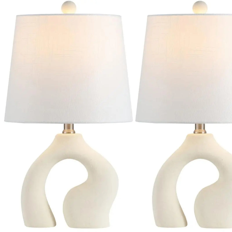 Modern cream ceramic table lamp set with white fabric shades and gold accents, perfect for contemporary decor.