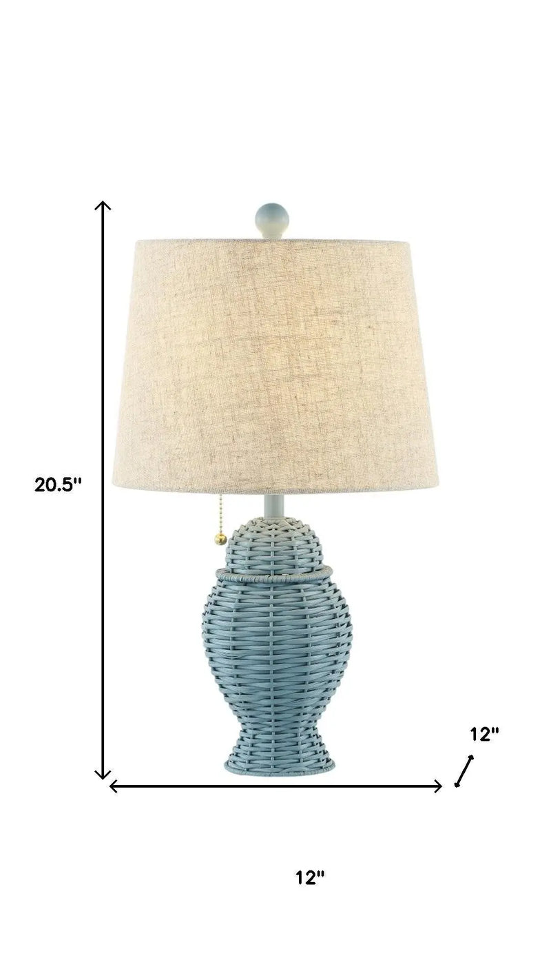Light blue woven rattan table lamp with beige linen shade, 20.5" tall, 12" wide, stylish coastal decor.