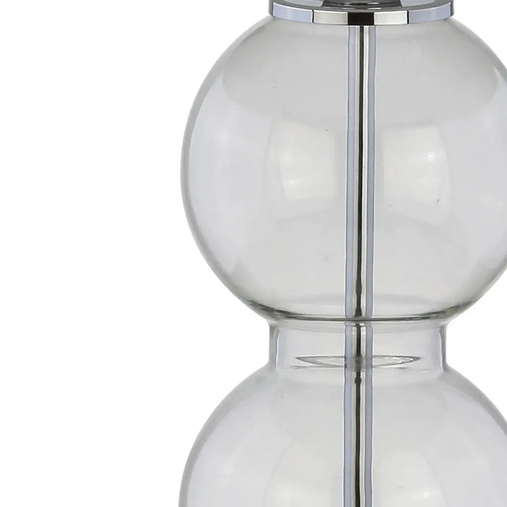 Clear glass decorative vase with a sleek silver metal accent, modern design, perfect for home decor.