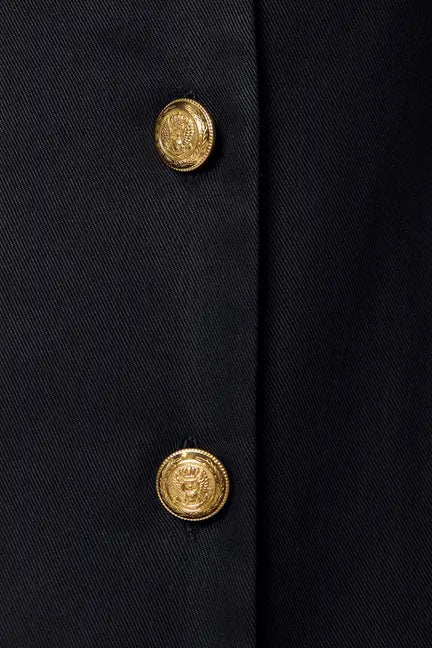 Black tailored blazer with gold embossed buttons, elegant design perfect for formal or business occasions.