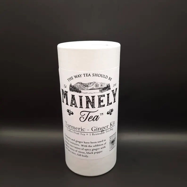 Mainely Tea Turmeric Ginger Kit in a white cylindrical container with black text, includes reusable tea bags.