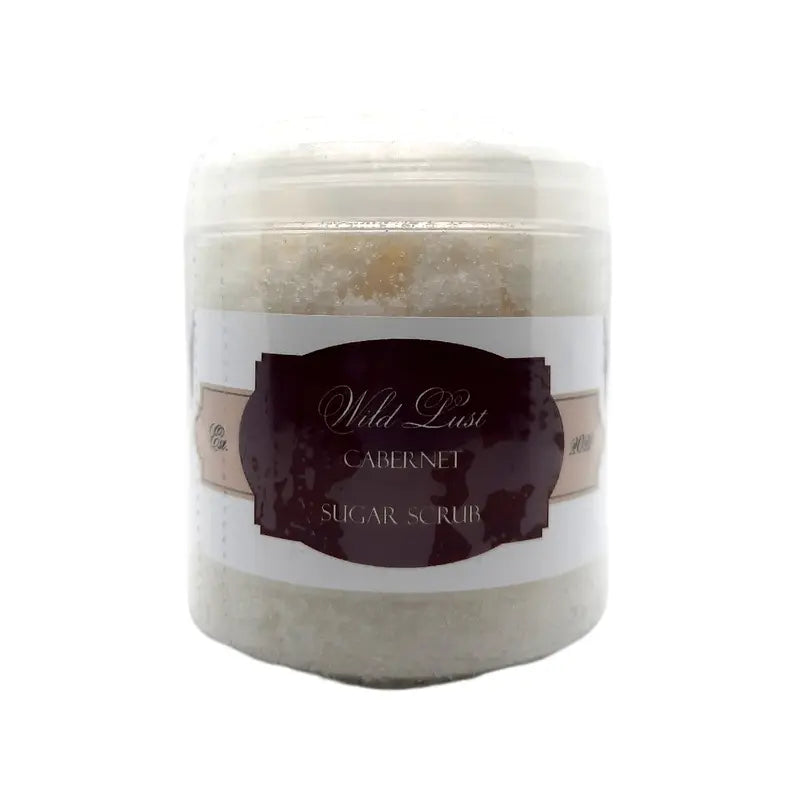 Wild Lust Cabernet Sugar Scrub in a clear jar with a white sugar texture, perfect for exfoliating and moisturizing skin.